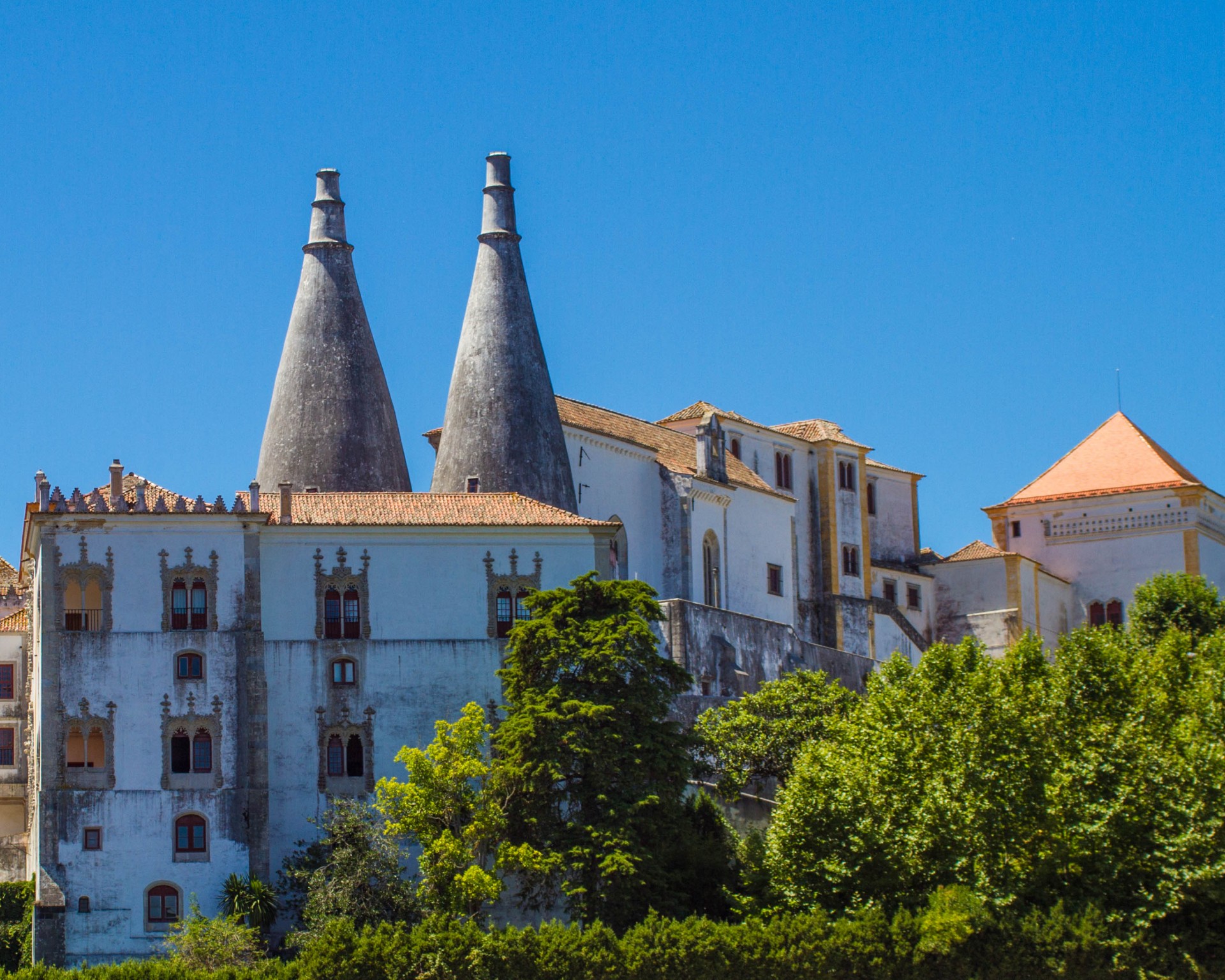 Chimney spires of Sintra, Portugals National Palace rise above the surrounding architecture