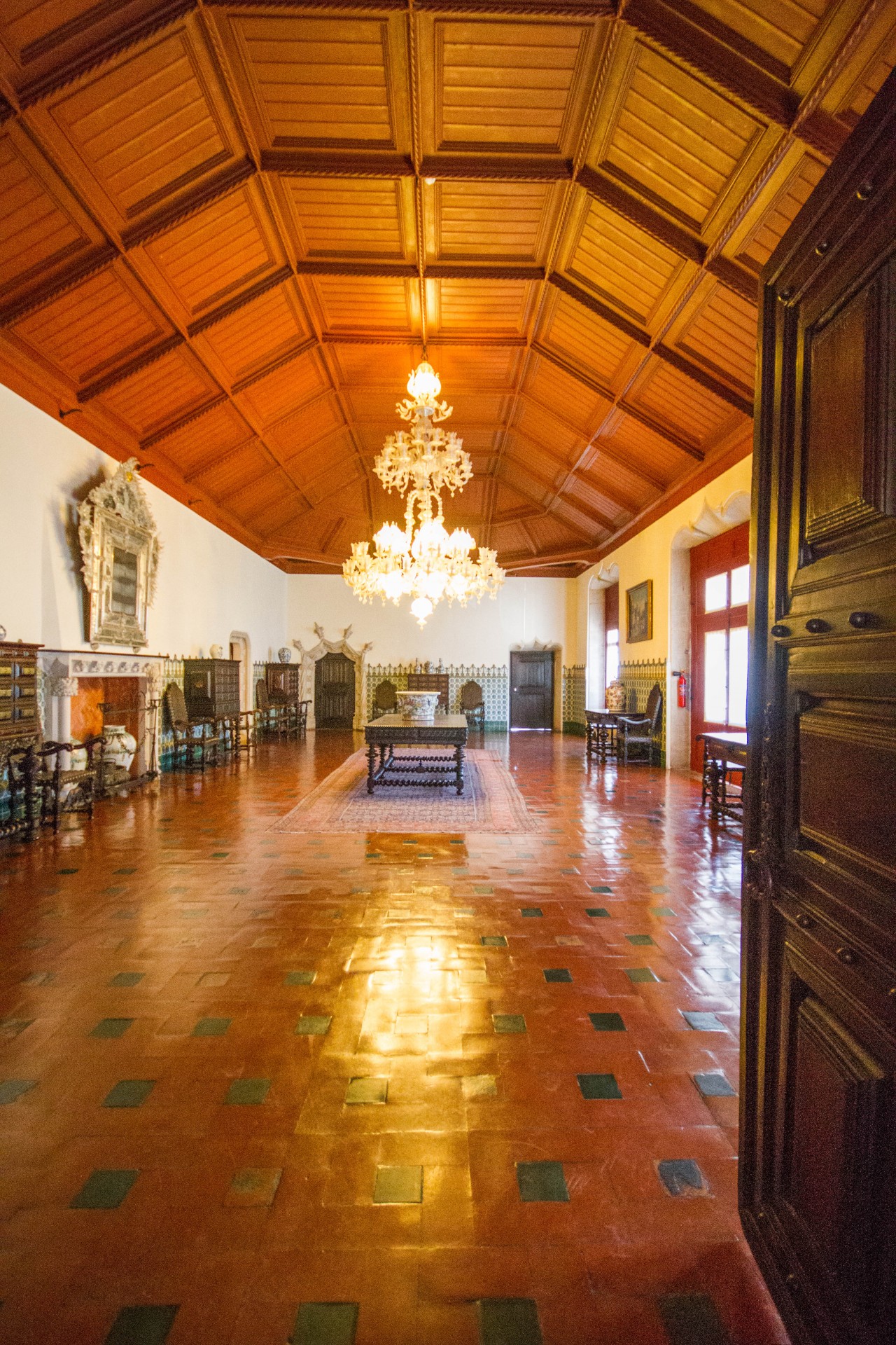 Great hall in the Sintra National Palace with a stunning chandalier and intricate wood ceiling - Sintra, Portugal