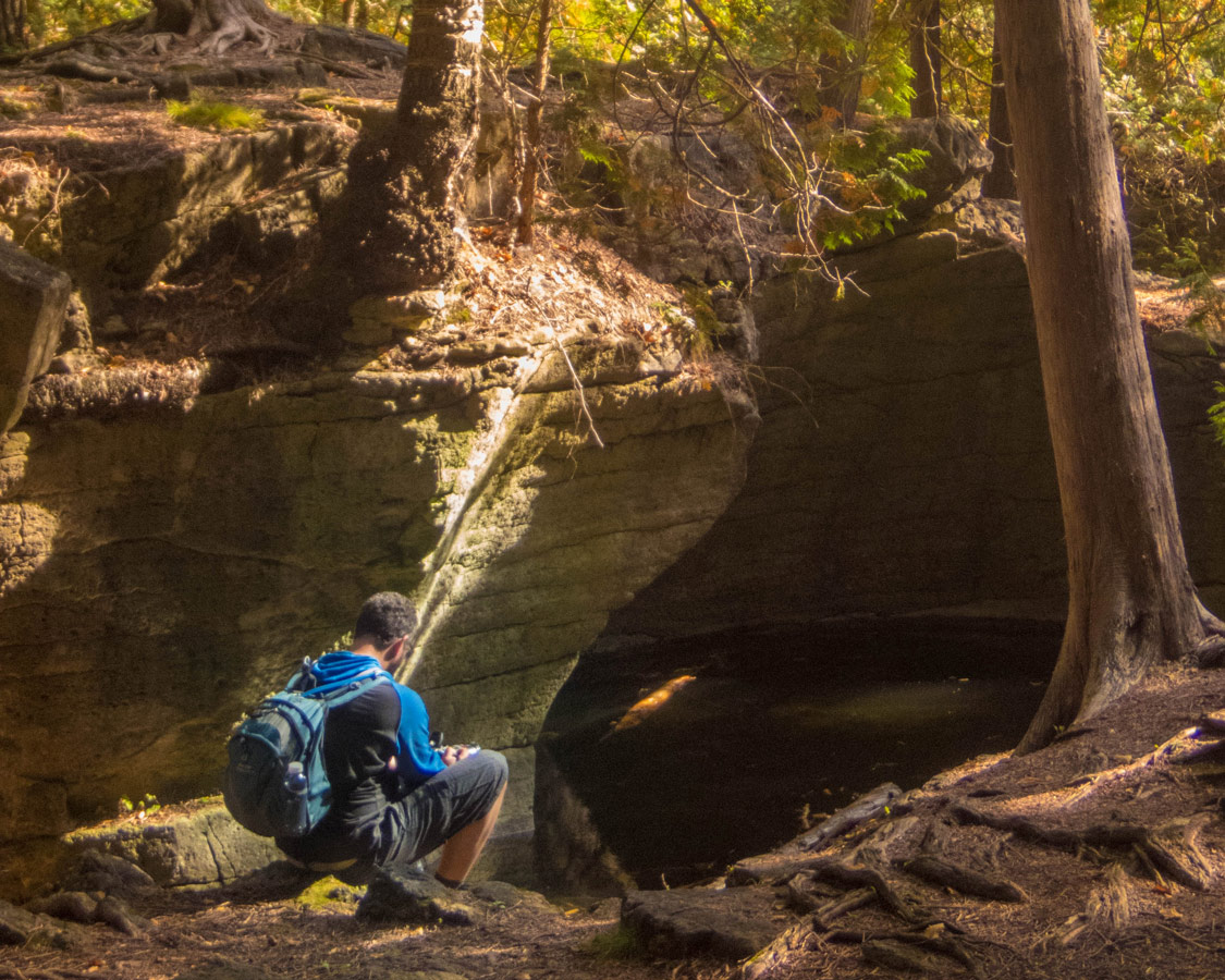 Kevin-sits-near-the-top-of-the-Limehouse-Conservation-Area-crevasses-in-Ontario