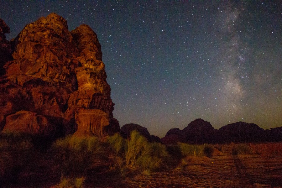 The milky way fills the sky over a Wadi Rum Bedouin camp