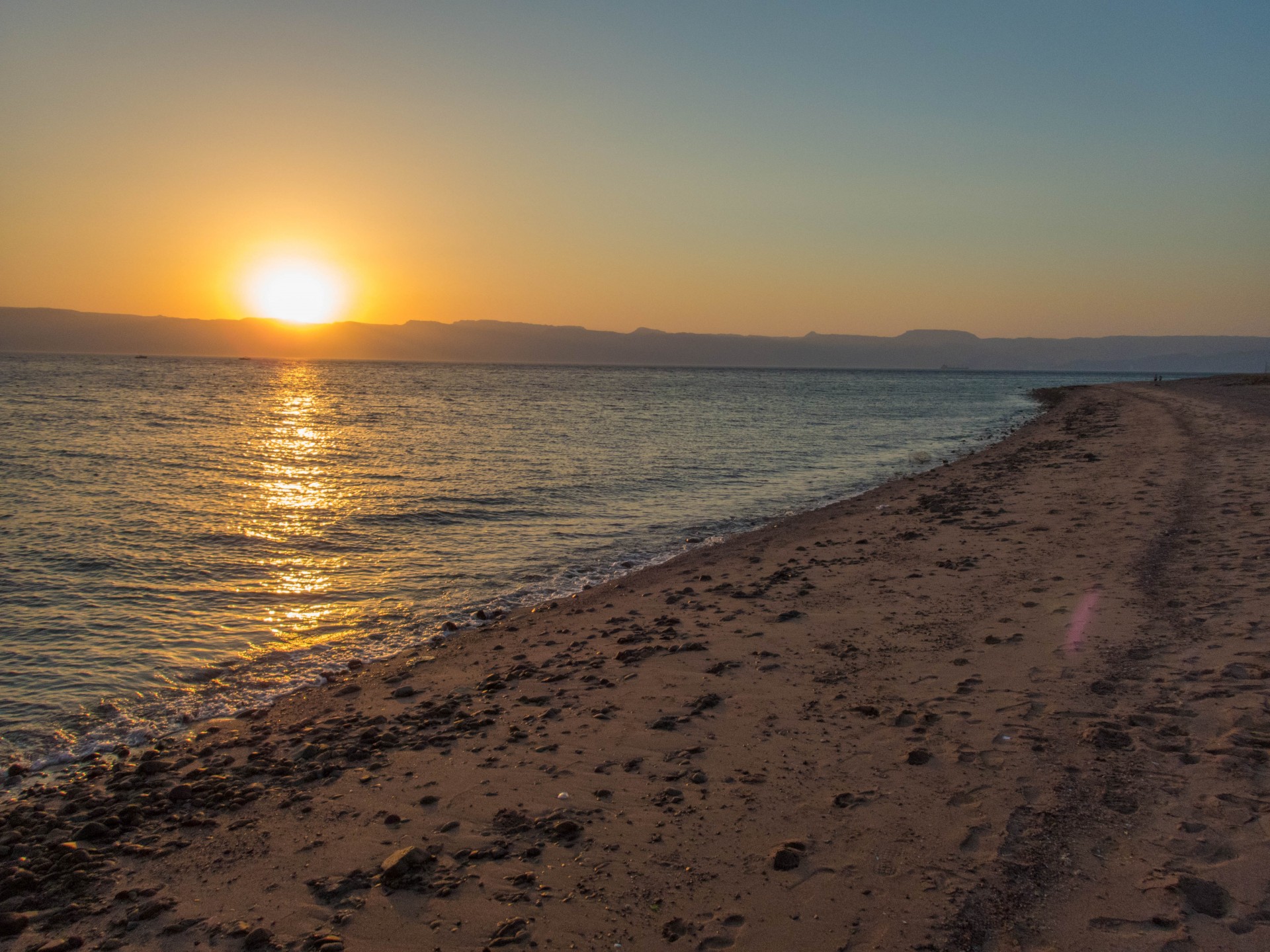 View Red Sea beach during the sunset in Aqaba Jordan.