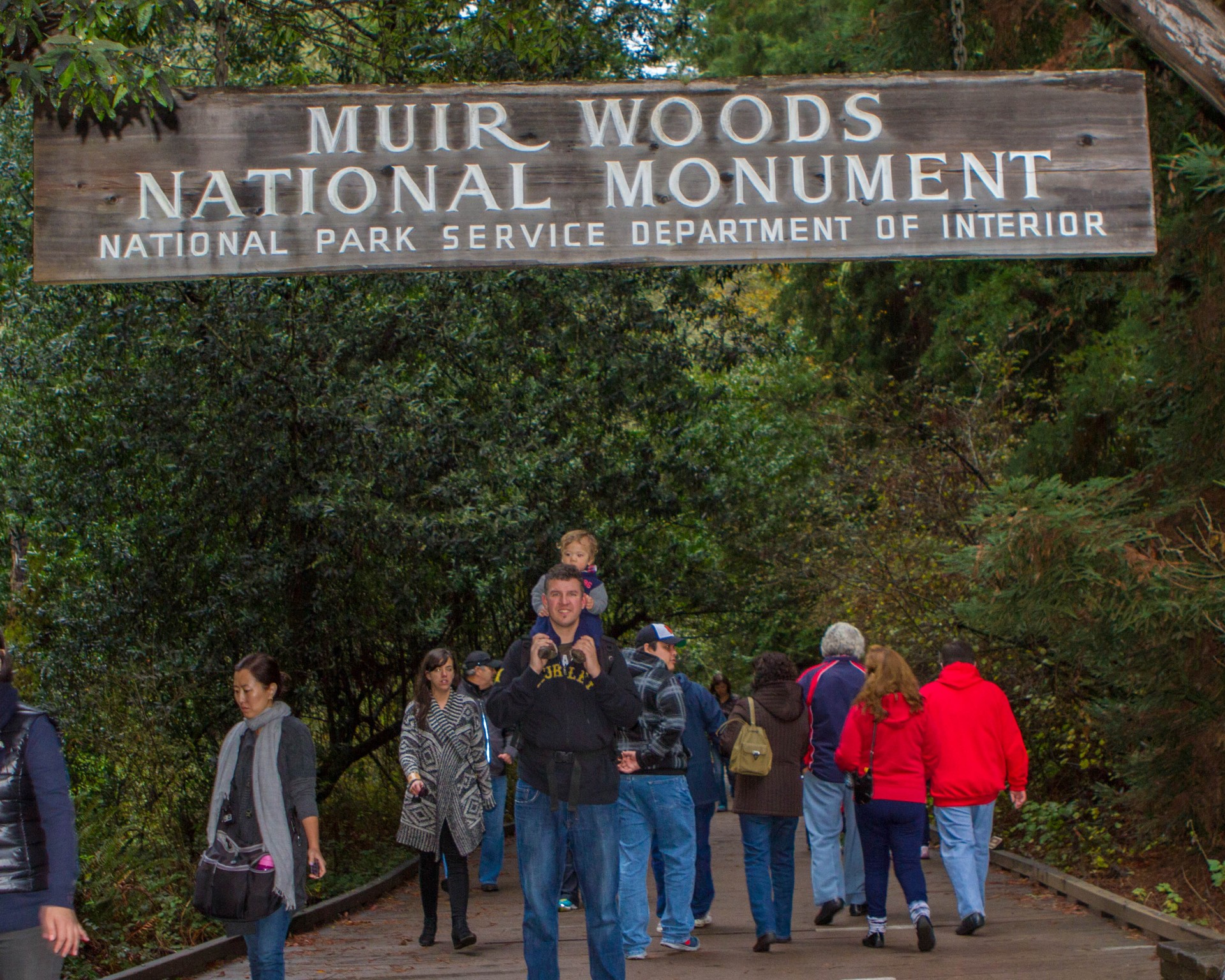 Father with son at main trail entrance of Muir Woods National Monument
