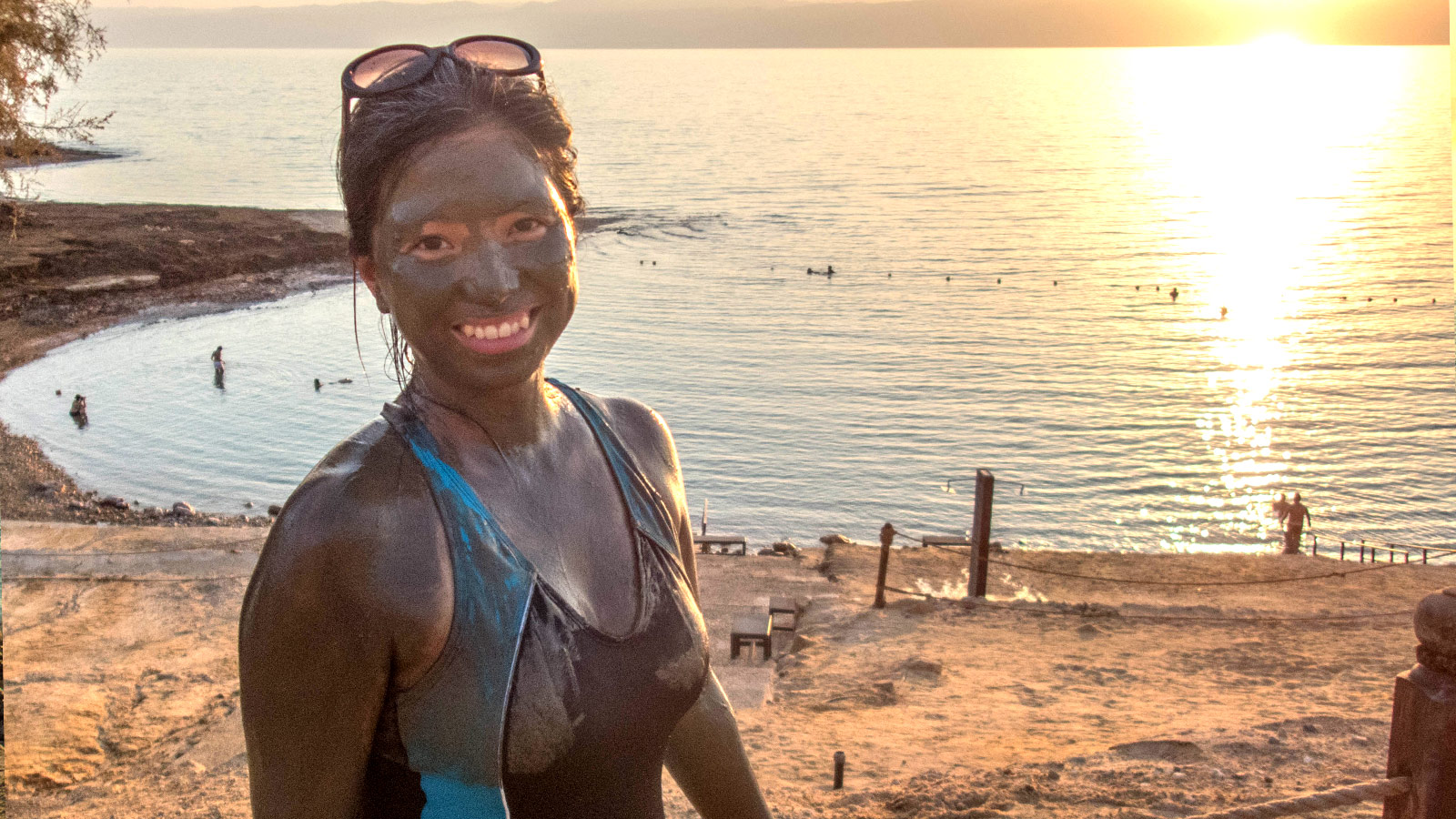 woman smiling in front of the Dead Sea