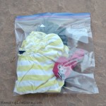 A change of children's clothes in a ziplock bag - Items to Keep Kids Healthy When Travelling