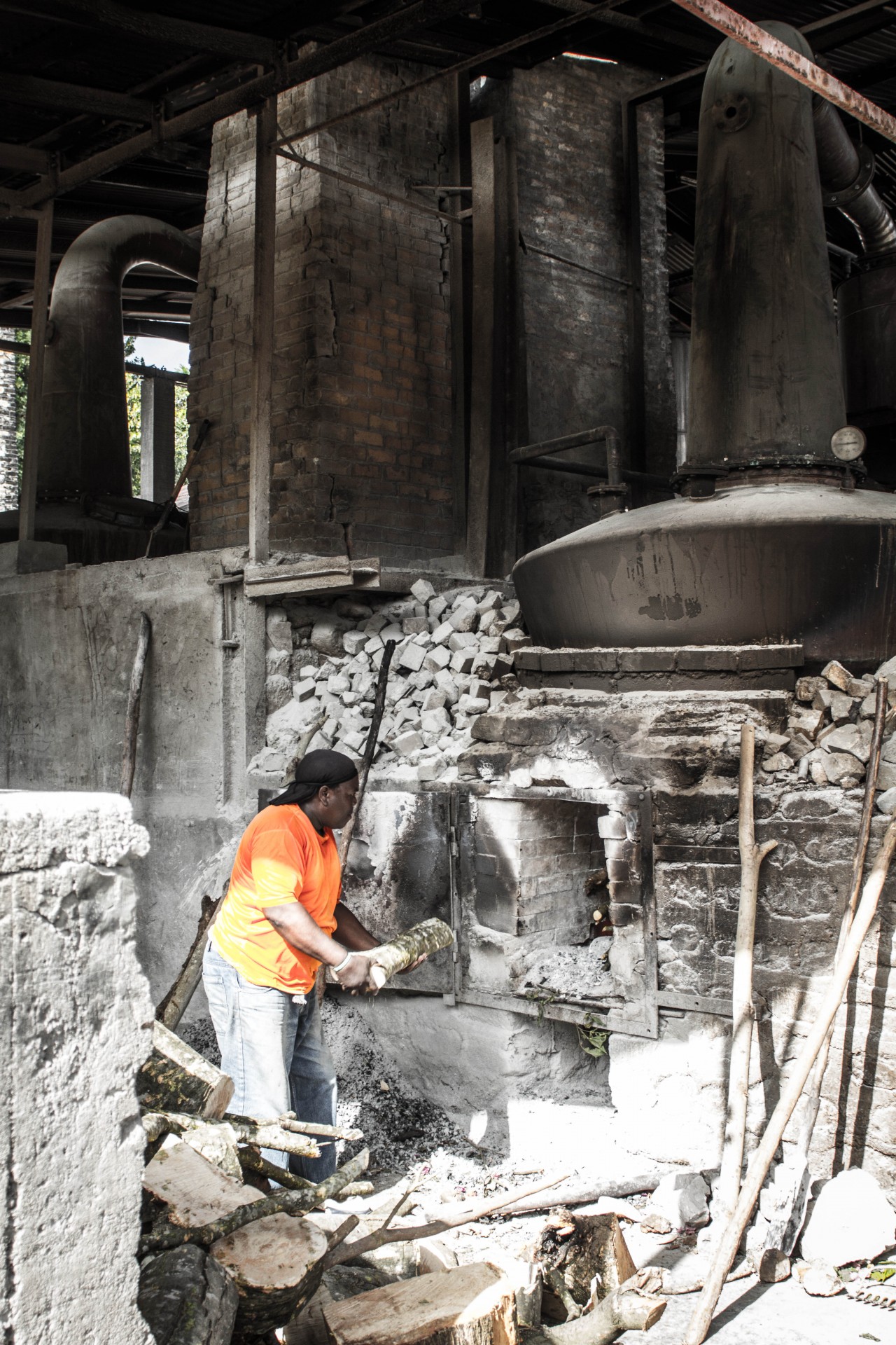 Grenada Tour - Rum Distillery worker