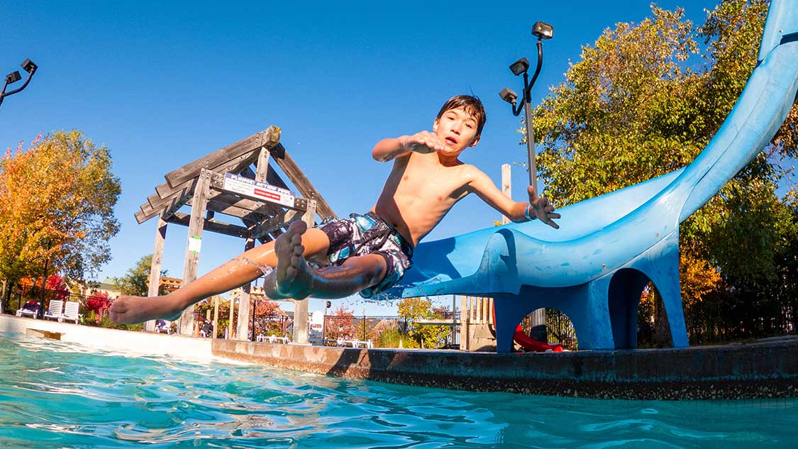 How to spend a weekend at Blue Mountain Resort - Boy sliding wildly off of a waterslide