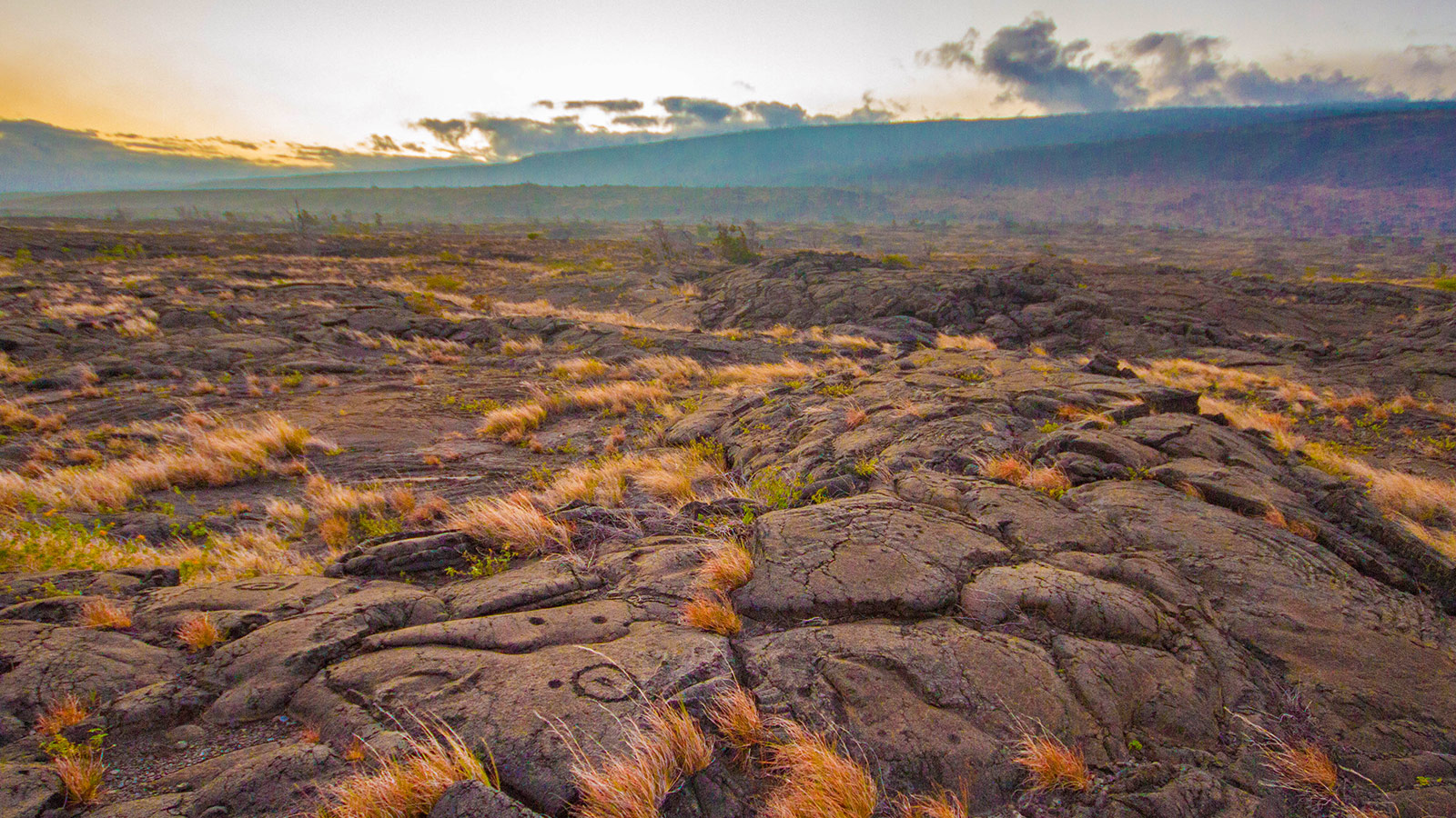 Petroglyphs are etched in the lava field at Volcanoes National Park in Hawaii