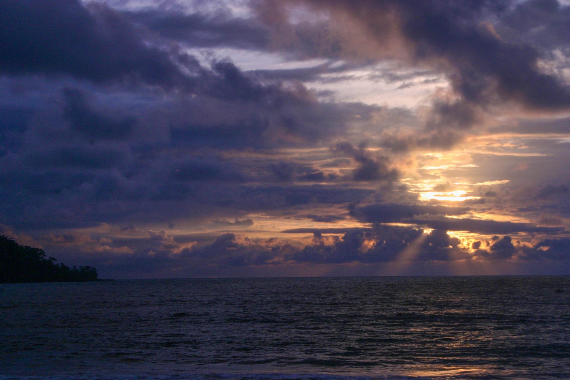 A beautiful sunset is reflected in the waters off the coast of Costa Rica - finding paradise in the osa peninsula