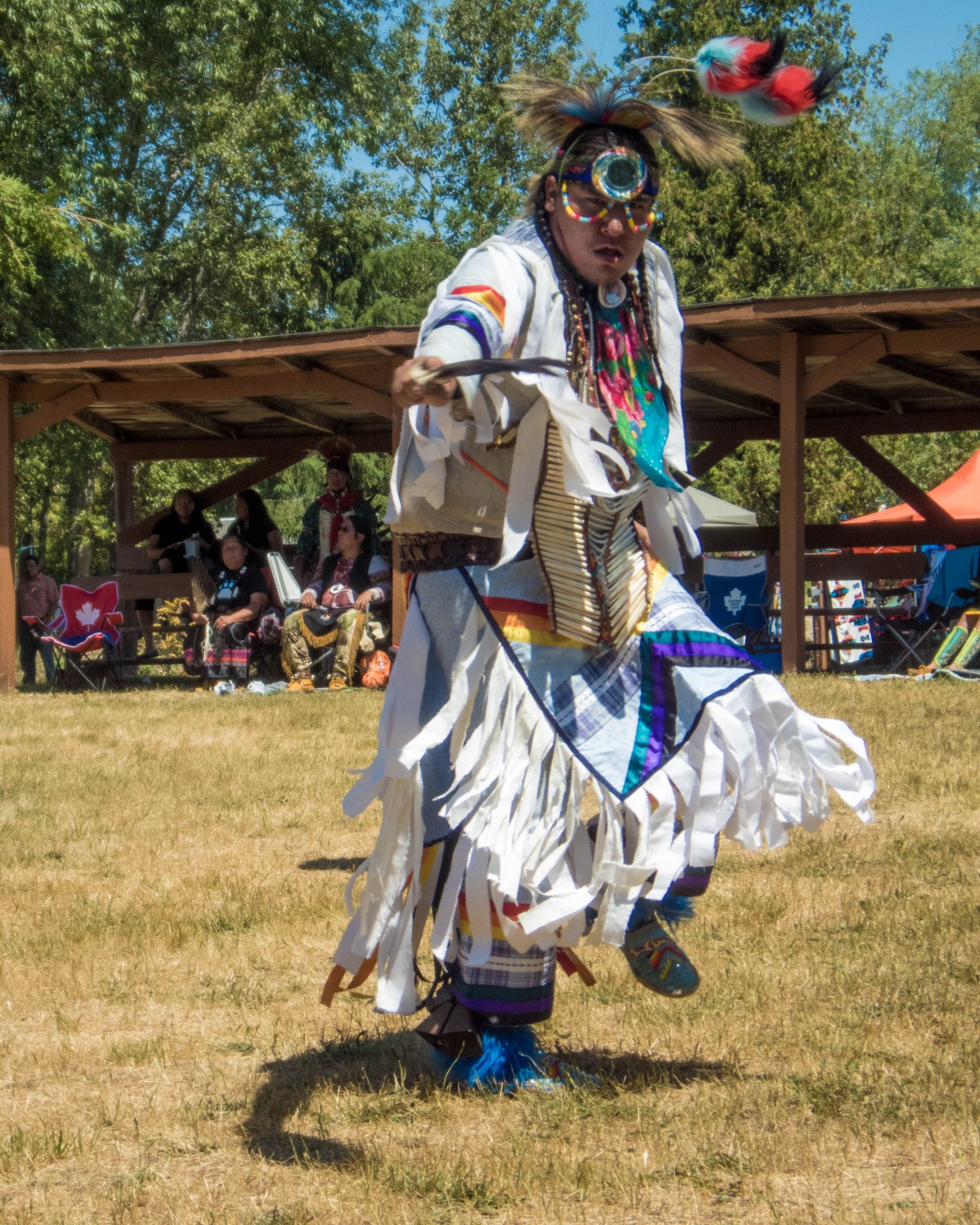 Man in regalia dancing at the Sheguiandah First Nation Traditional Pow Wow on Manitoulin Island.