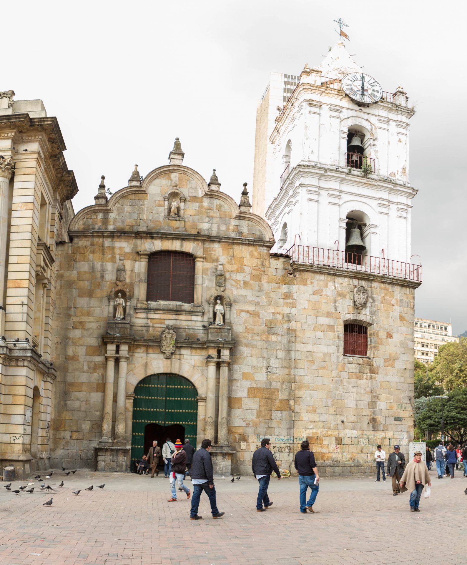 Facade of St Francis Church with people in the street in Bogota Colombia.