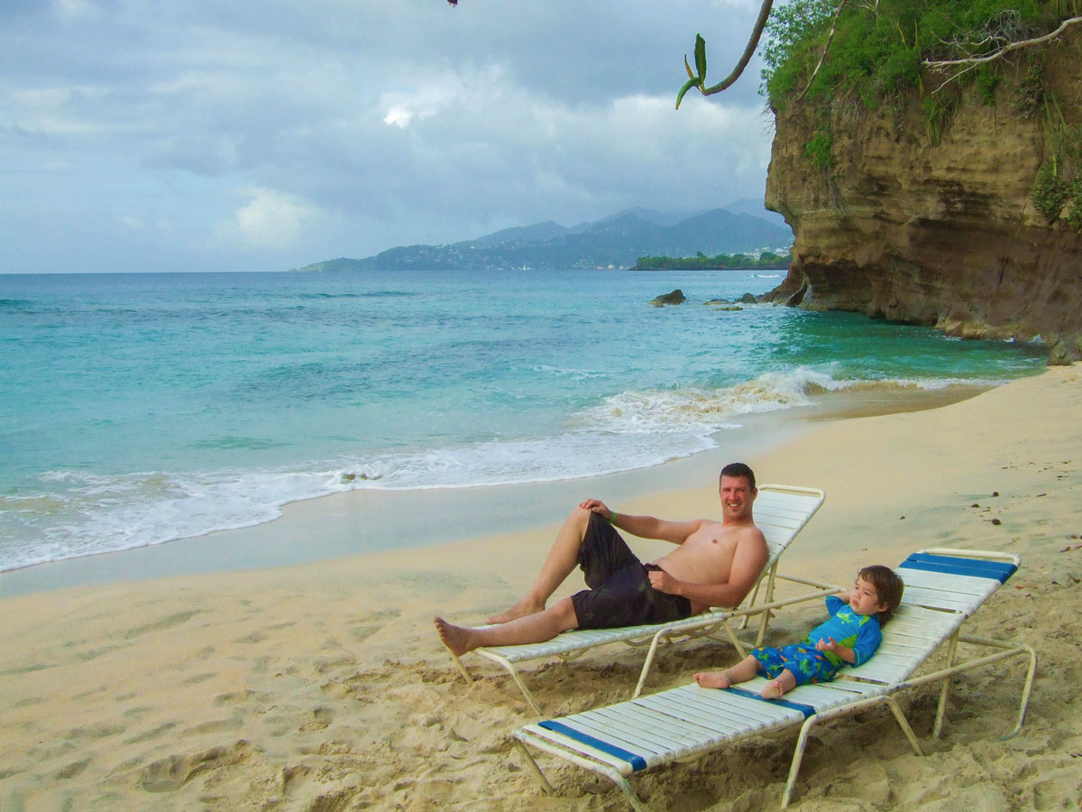 Kevin Wagar and his son relax on the beach in Grenada