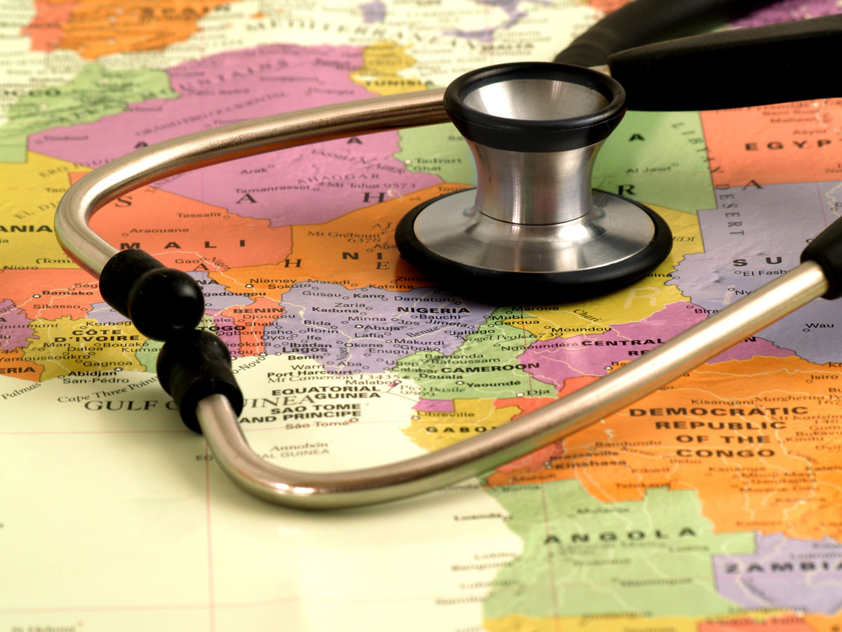 A stethoscope on a world map - plan international family vacations