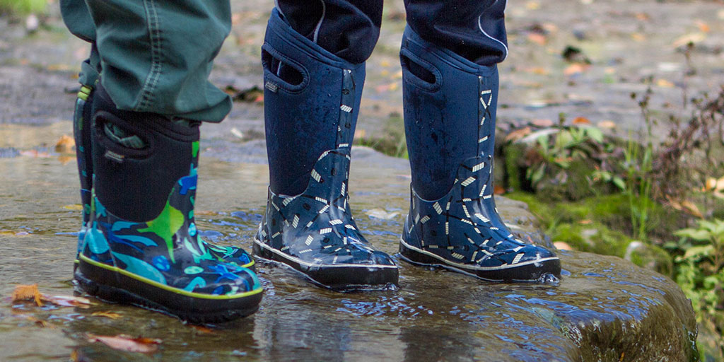 Closeup of children wearing bogs snow boots - Bogs kids winter snow boots