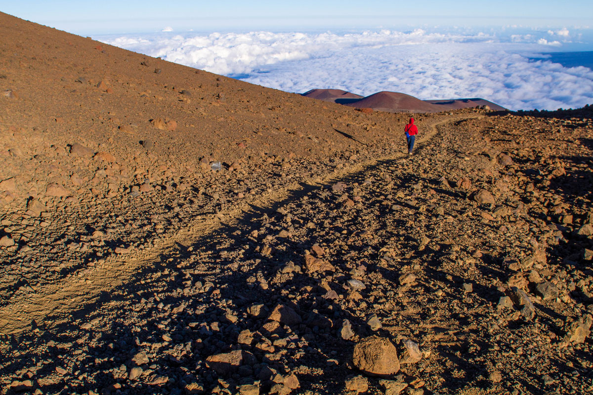 Woman on trail in the Mauna Kea Ice Age Natural Area Reserve.