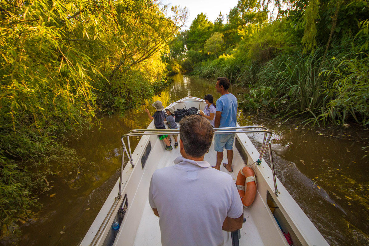 Boating through the narrow rivers of the delta Parana in Tigre, Argentina