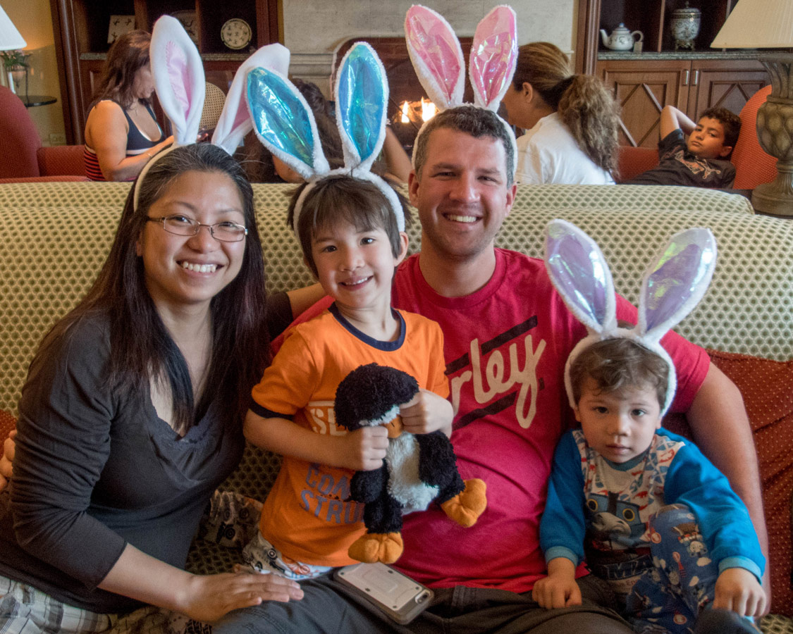 A young family wearing bunny ears at an Easter breakfast in Bermuda