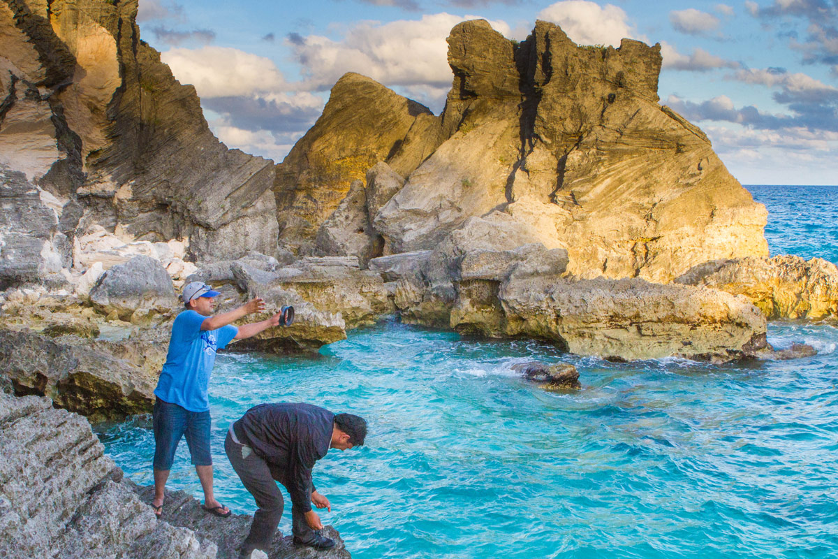 Fishermen toss their lines from the rocks near Horseshoe Bay Beach in Bermuda