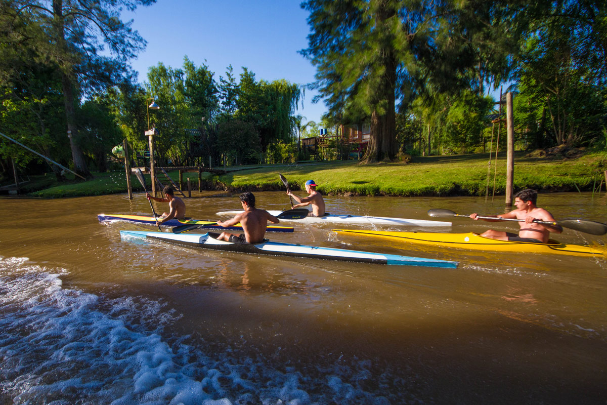 Kayakers race along the Delta Parana in Tigre, Argentina