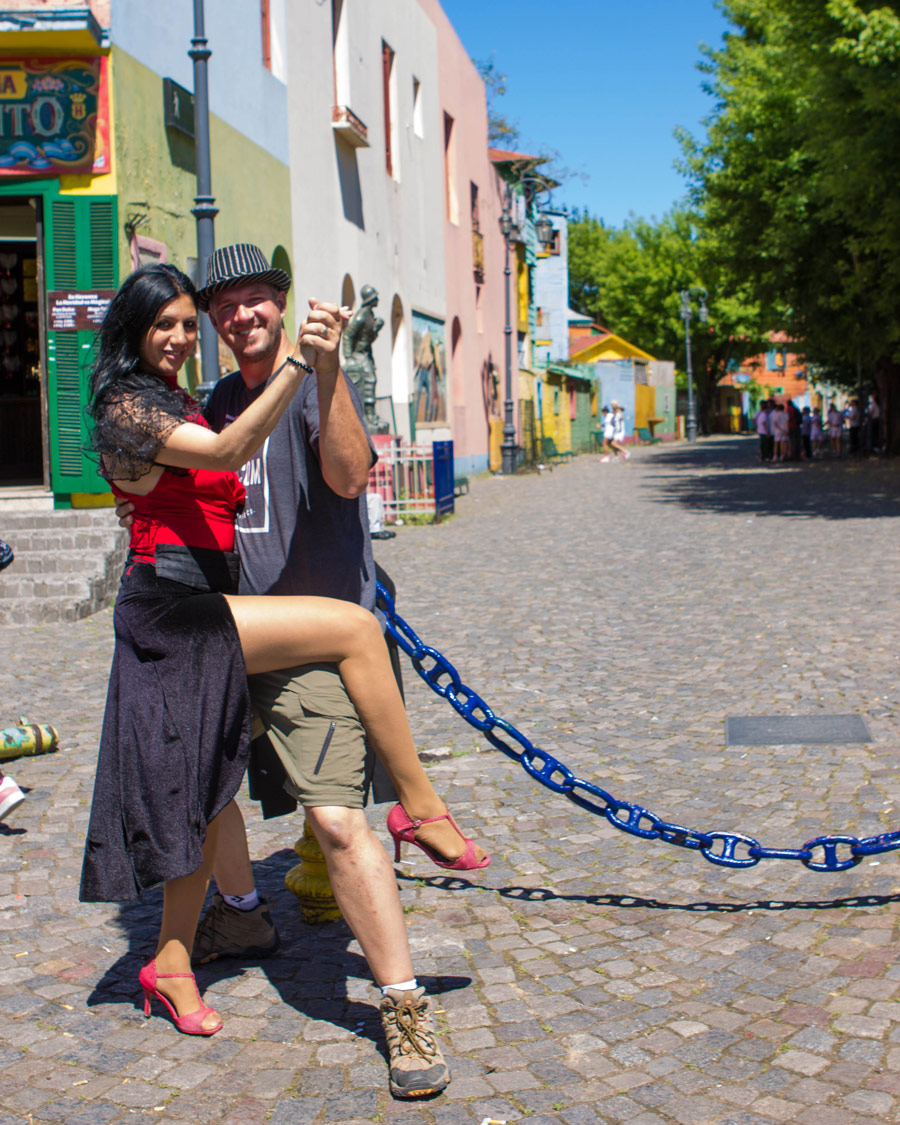 Man poses with a Tango performer in La Boca, Buenos Aires.