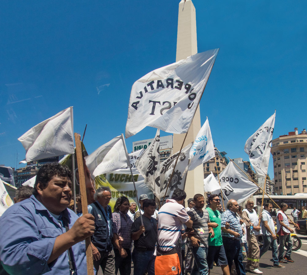 Protestors passing by the Obelisk in Retiro district of Buenos Aires.