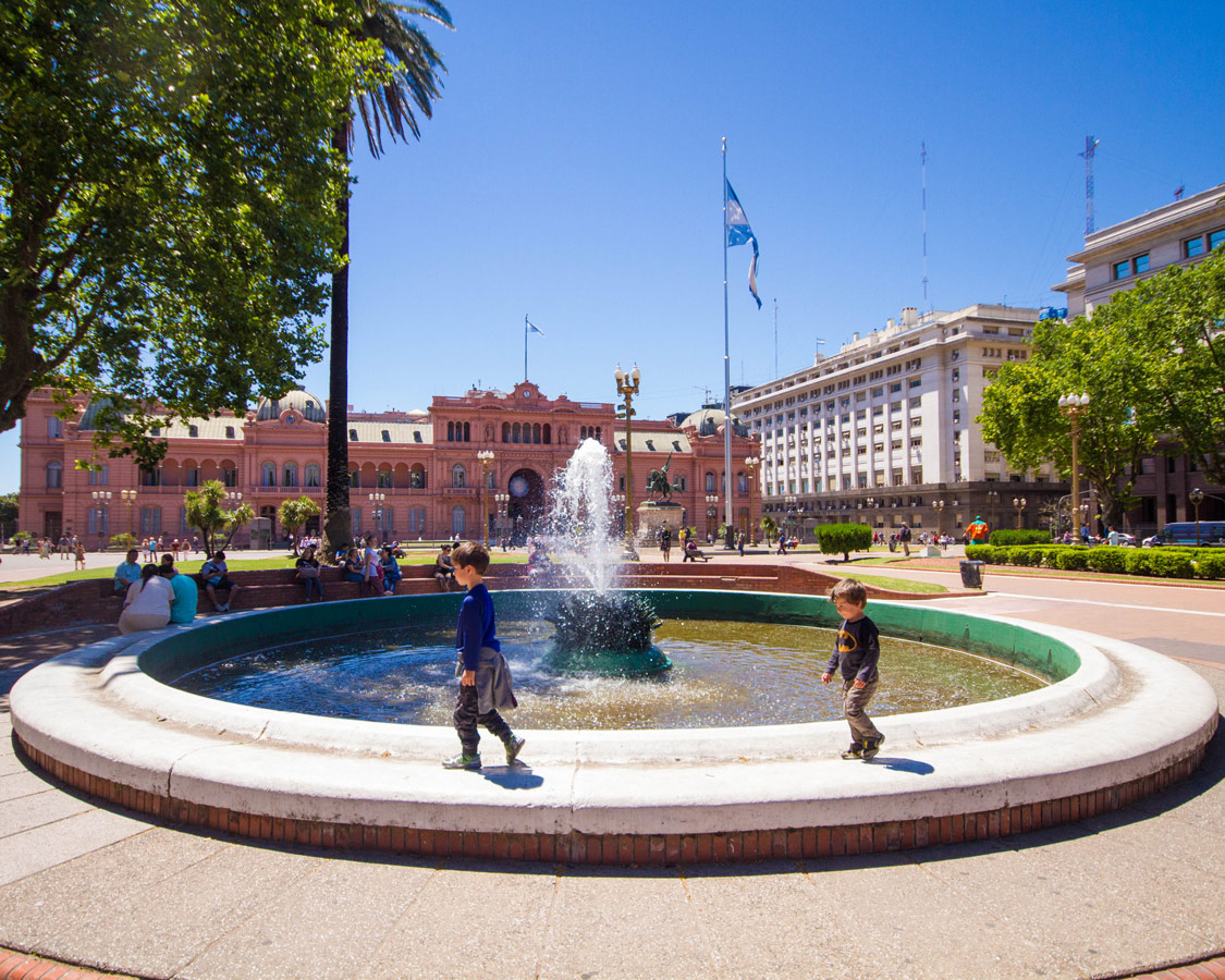 Boys playing at the fountain in Plaza de Mayo.