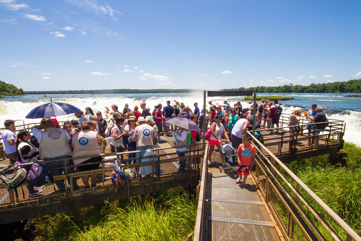 Crowded viewpoint at Devil's Point lookout in Iguazu Falls Argentina.