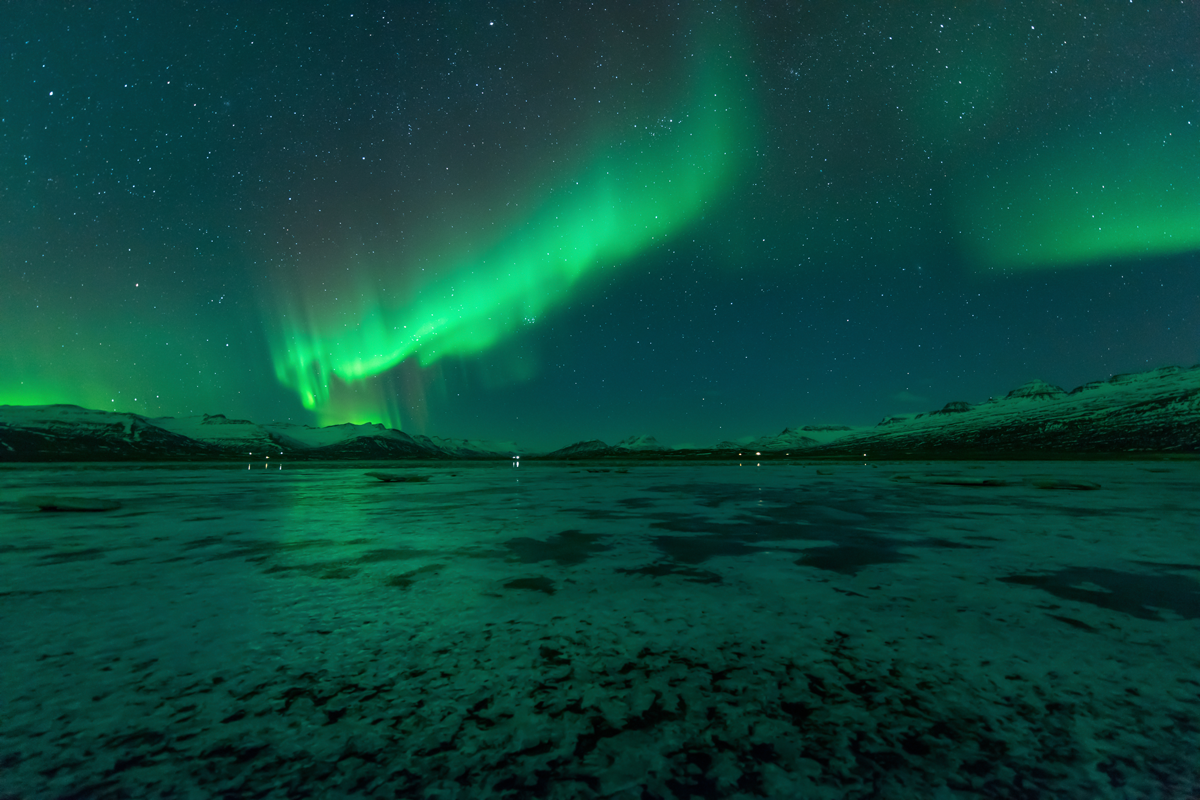 green sheets of aurora borealis shine over Great Slave Lake in the Northwest Territories