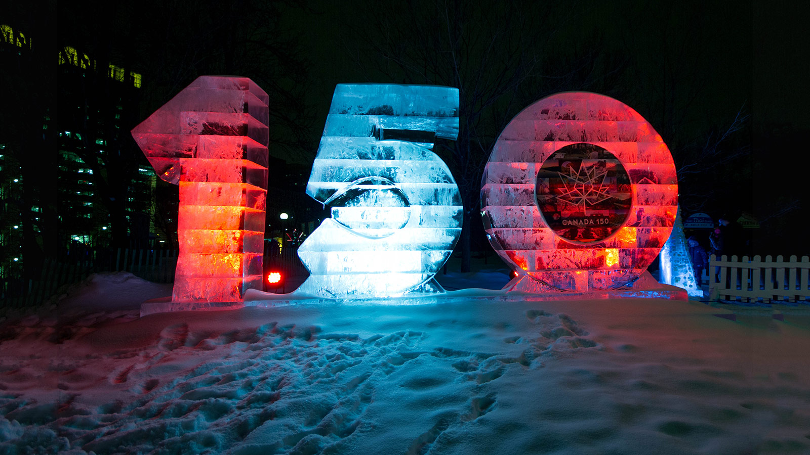 Ice sculpture that reads 150 illuminated in red and white