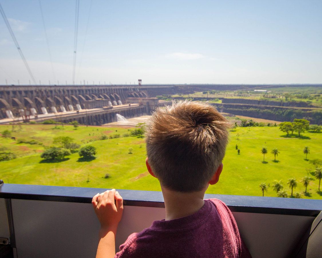 Boy looking in awe at the Itaipu Dam.