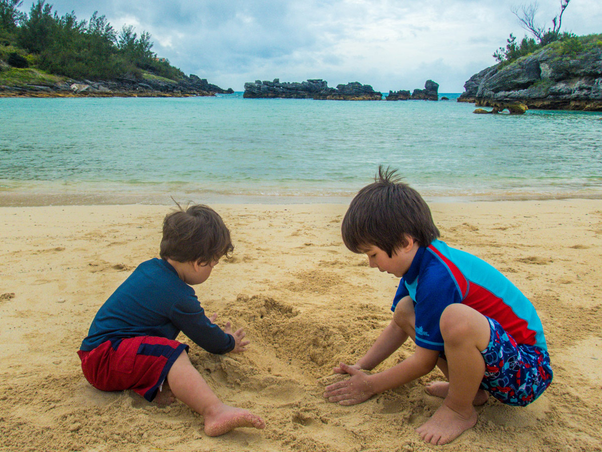 Boys playing in the sands of Tobacco Bay, St George Bermuda.