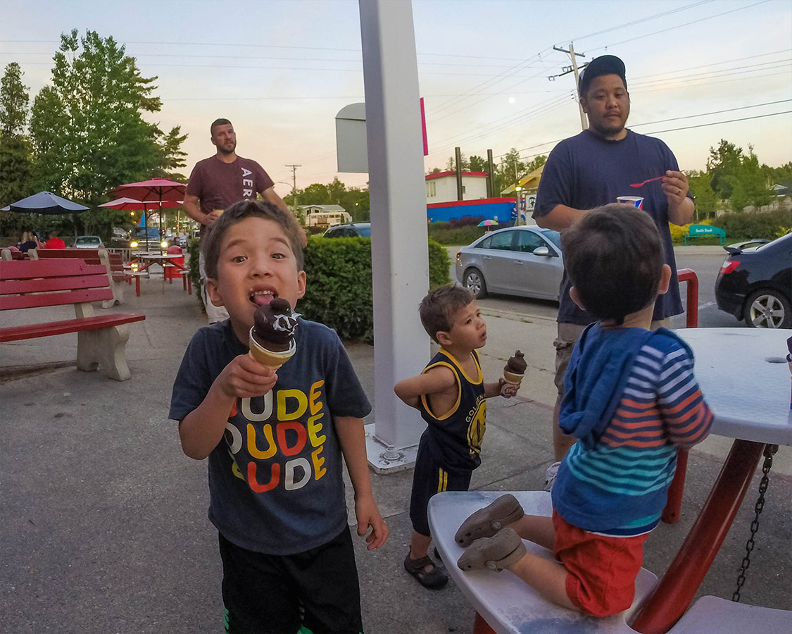 Boy eating an ice cream cone discovers What to do in Sauble Beach Ontario