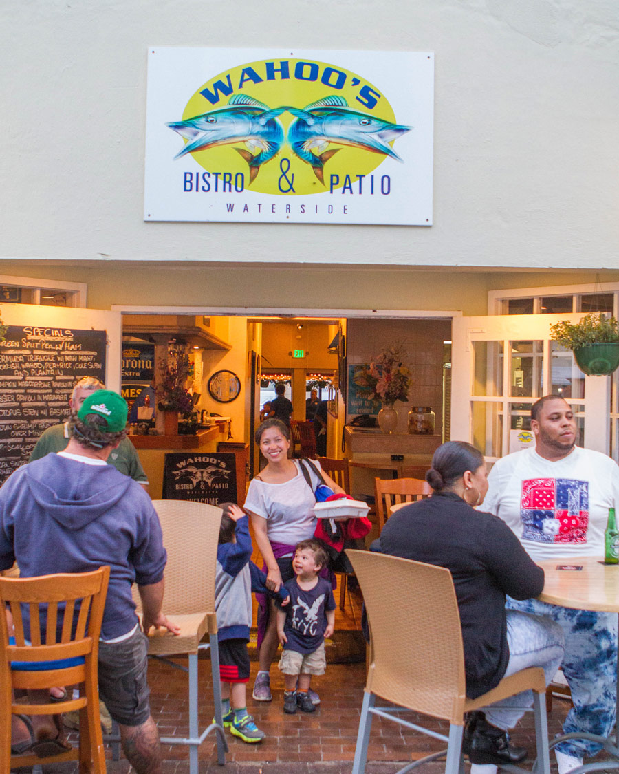 Woman leaving Wahoo Bistro and Pub in St George Bermuda.