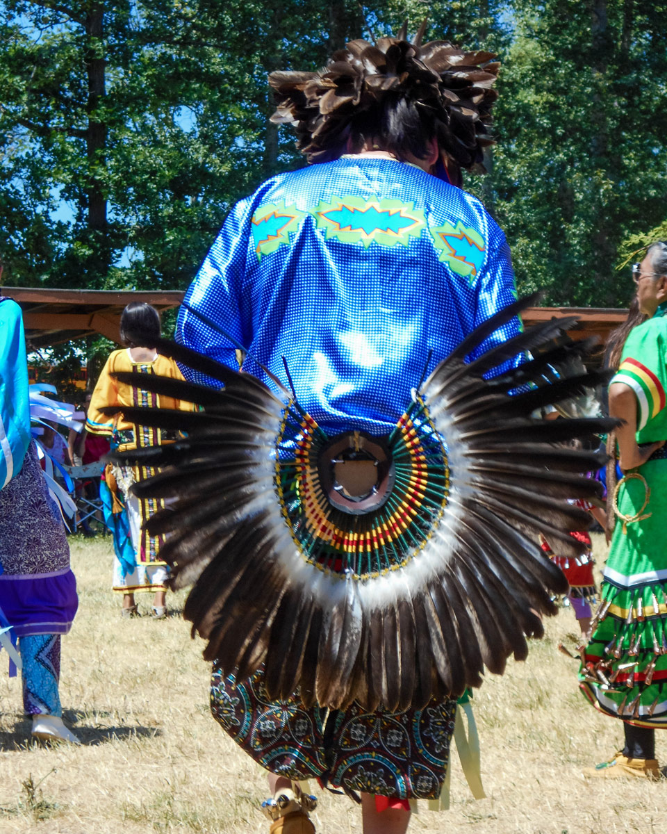 A dancer with an eagle feather tail at a Pow Wow in Ontario