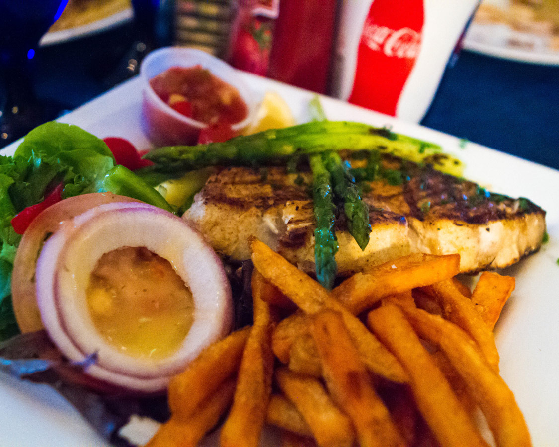 Fresh fish with french fries and salad from Wahoos Bistro and Pub.