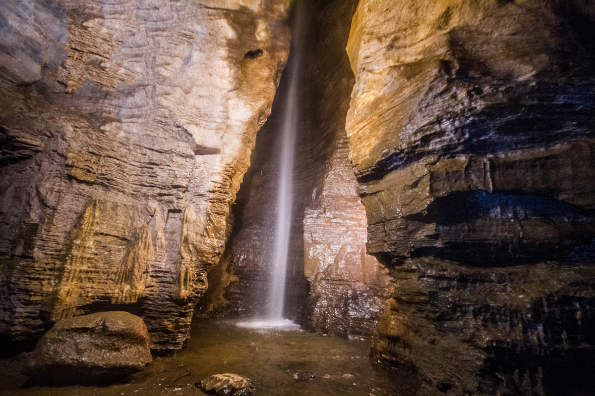 The 100-ft waterfall at the end of the guided tour at Secret Caverns New York is the highlight of the visit to this show cave.