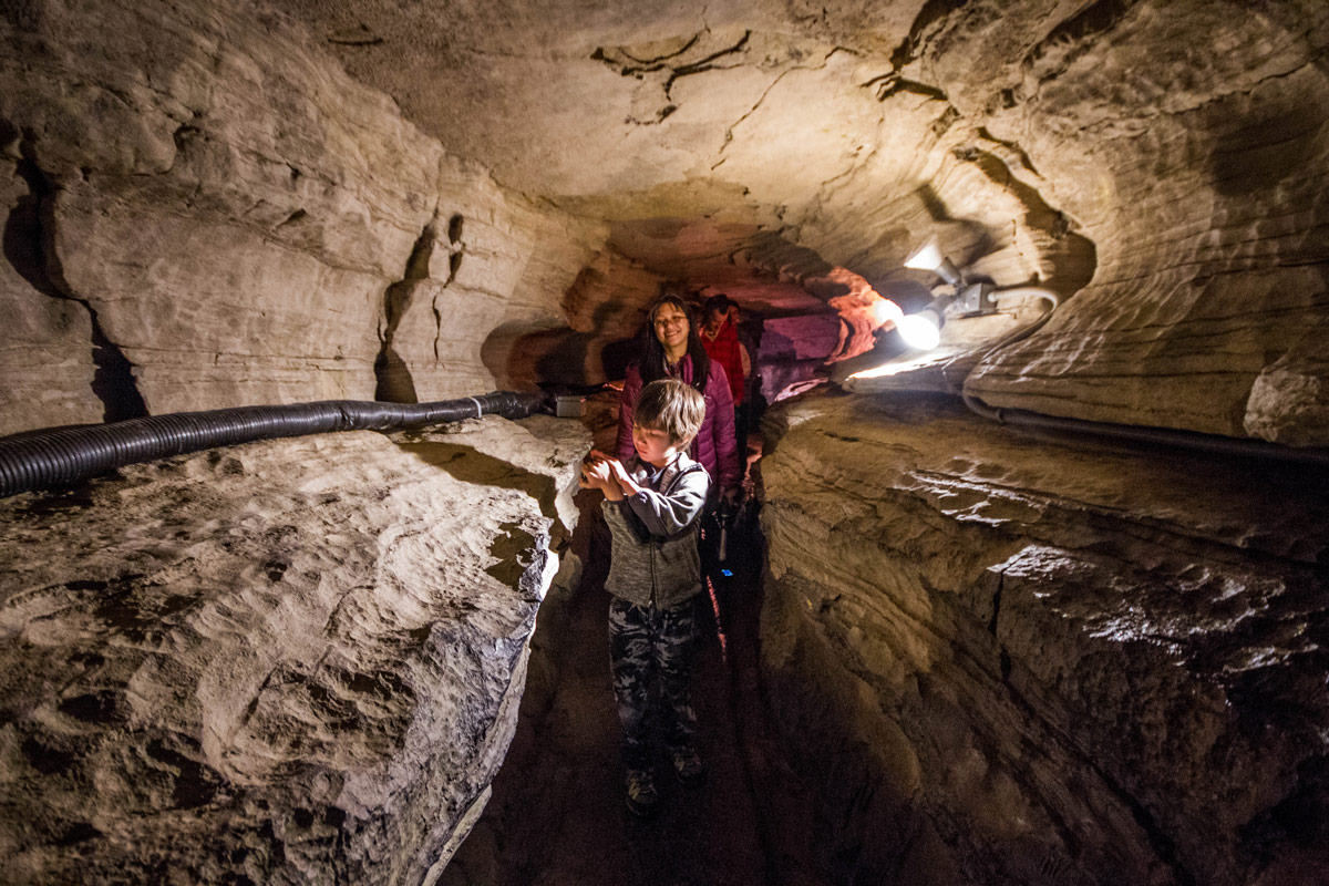 Christina-and-C-walk-through-the-narrow-paths-of-Secret-Caverns-in-Howes-Caves-New-York