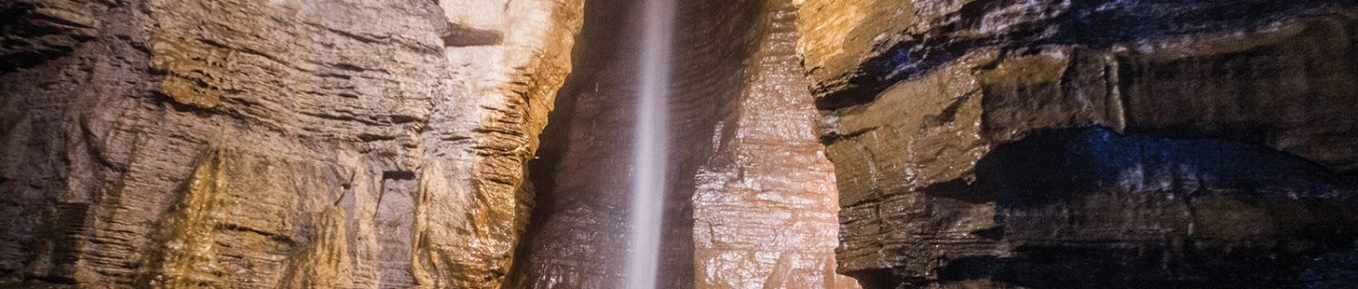 The 100-ft waterfall at the end of the guided tour of Secret Caverns New York was the highlight of our family trip to this show cave.