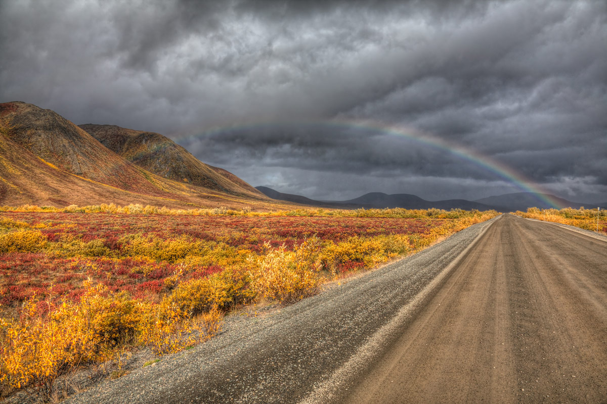 A rainbow and stormy clouds along the Dempster Highway in the Northwest Territories one of the most amazing places in Canada