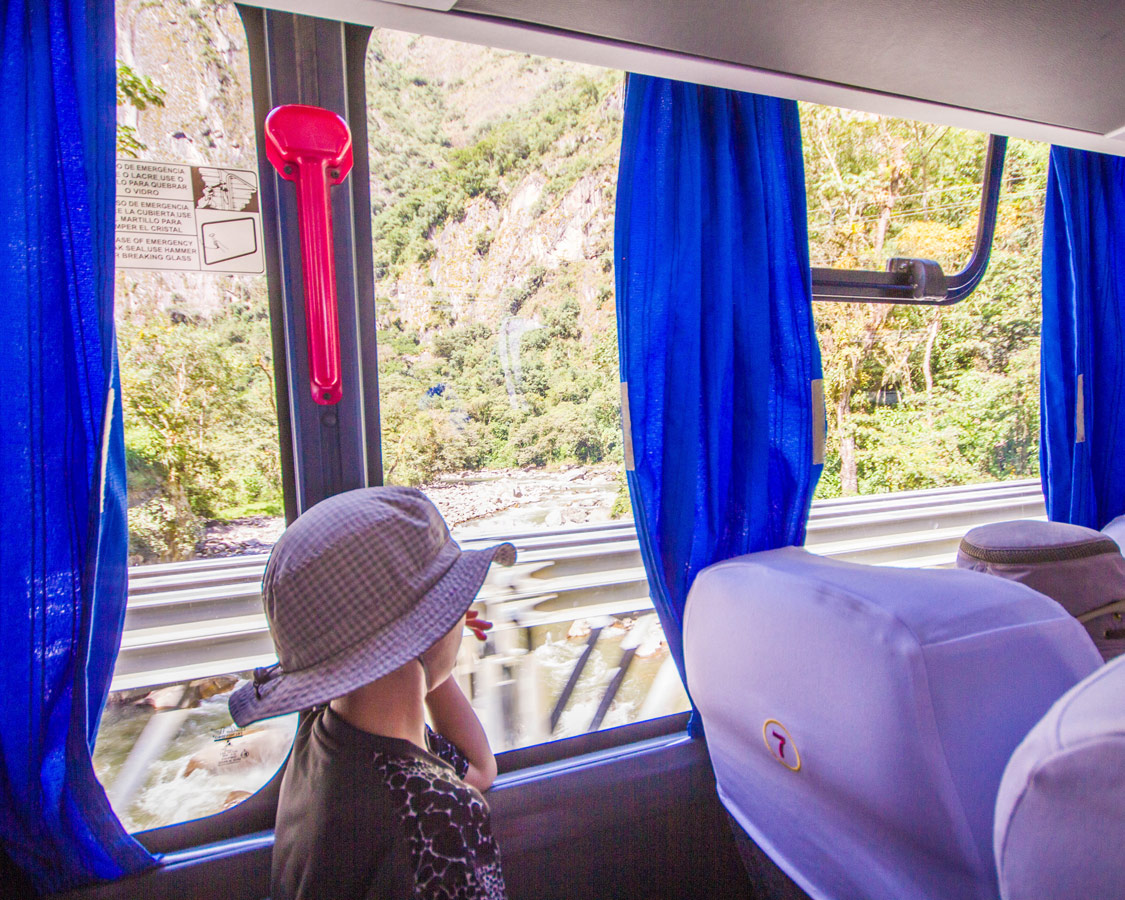 Boy enjoying the view as the bus drives up Machu Picchu mountain.