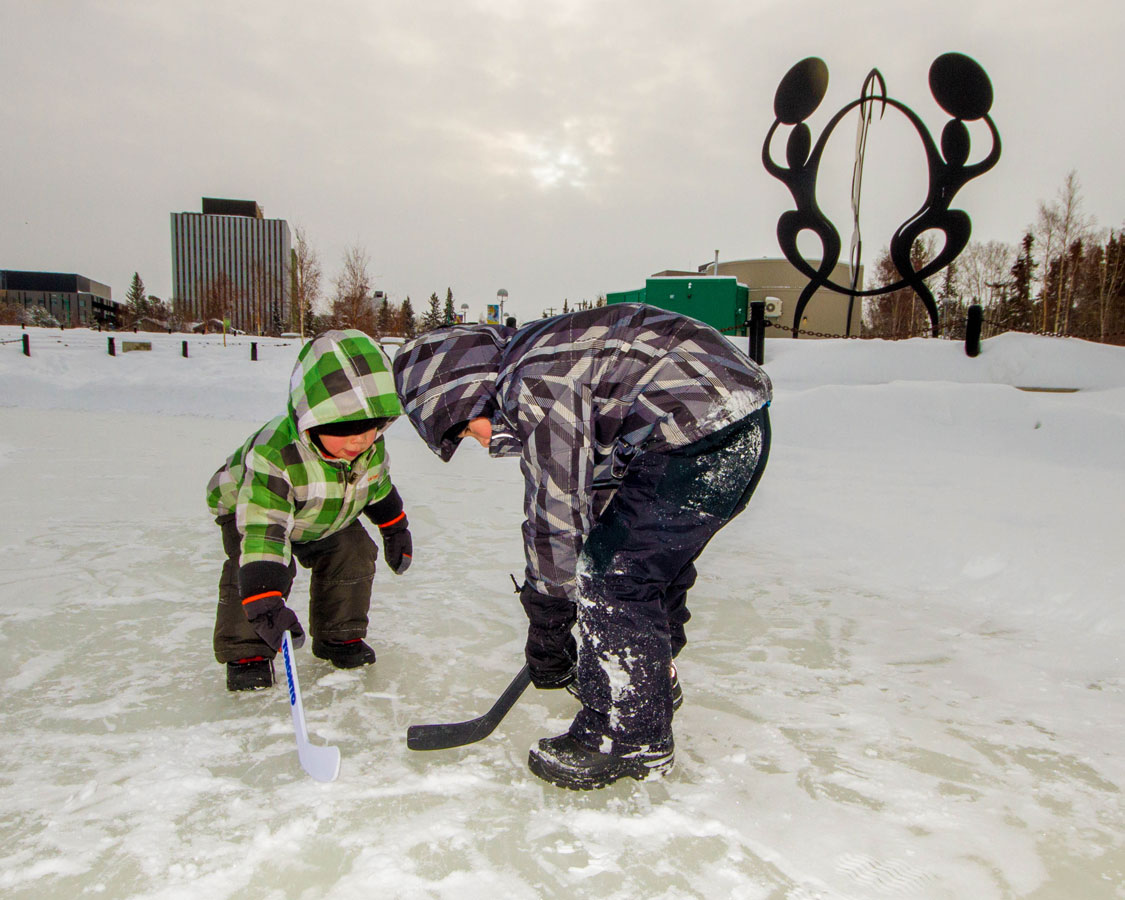 Children playing ice hockey in Yellowknife Northwest Territories one of the most amazing places in Canada