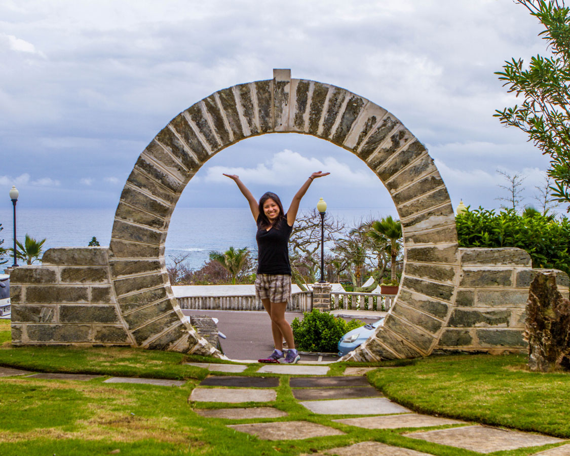 Christina shows off one of the beautiful Moongates in Bermuda