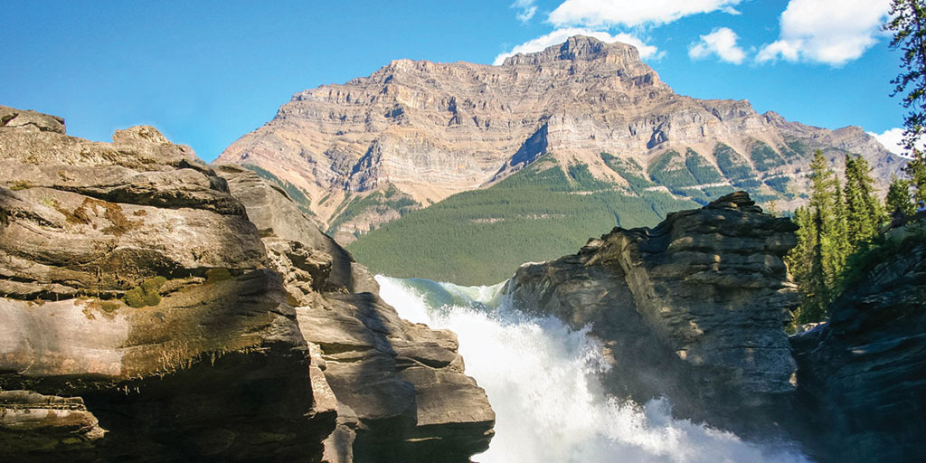 Waterfalls and rocky mountains make for amazing places to visit in Canada