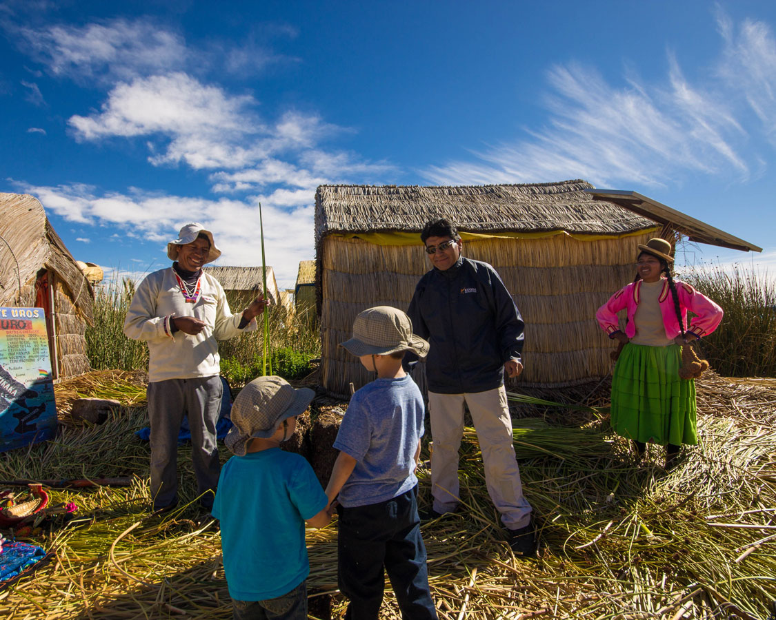 While visiting Lake Titicaca with kids, two young boys are shown how the reed islands of Uros are made by an indigenous elder.