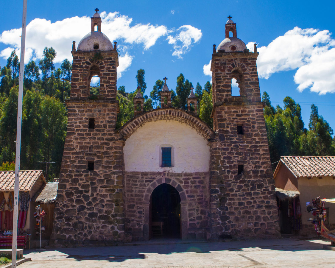 A stone and adobe baroque church in Raqchi Peru. It is seen during the Cusco to Puno bus tour with Inka Express
