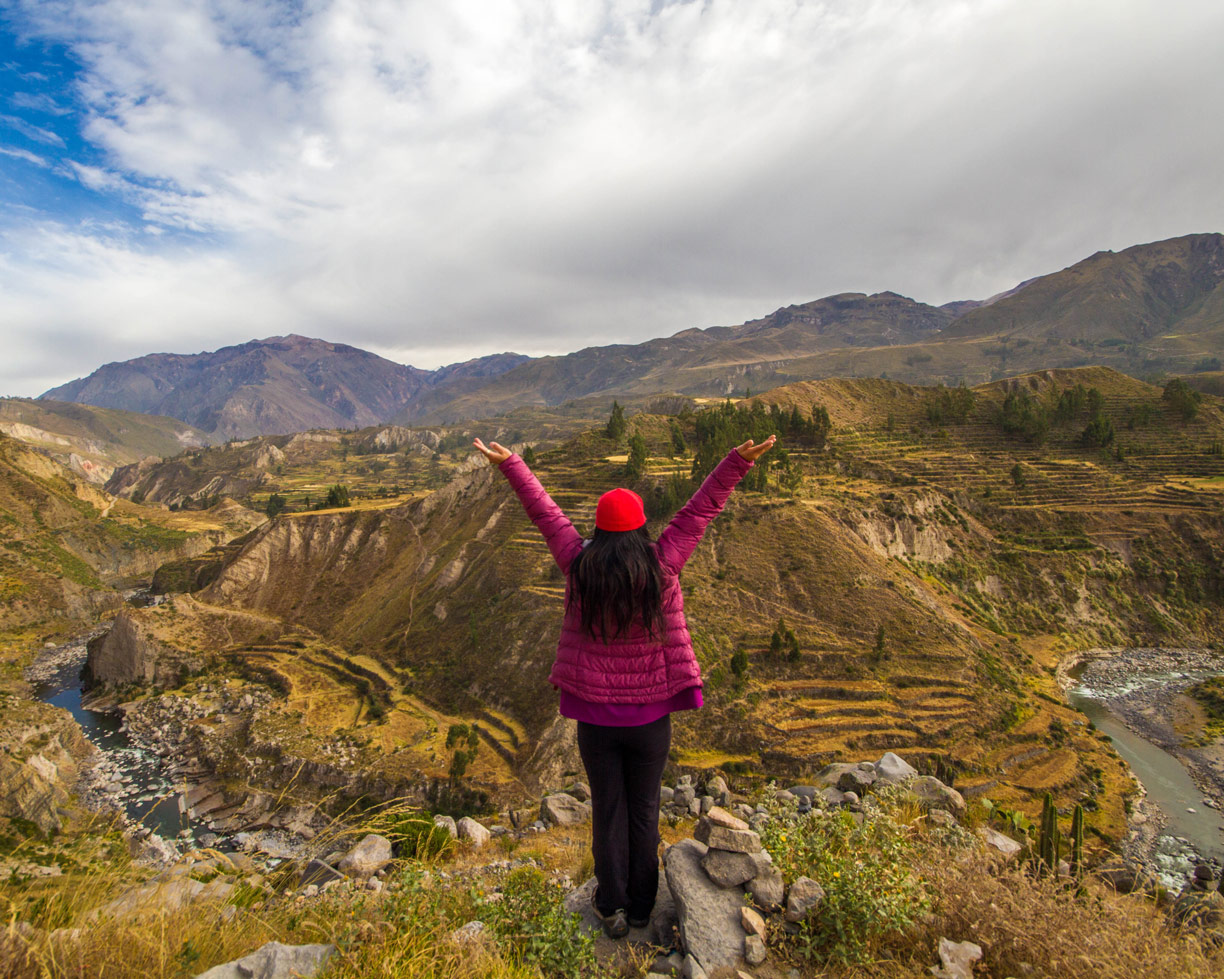 Christina Wagar celebrates the view at Colca Canyon Peru as we prepare to view the Andean Condors in Colca Canyon with kids