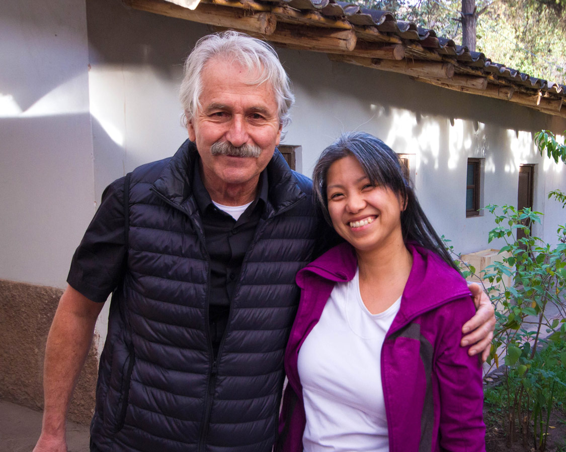 Travel writer Christina Wagar and Pablo Semniario smiling after our ceramics painting for kids workshop at Taller Ceramica in Urubamba Peru