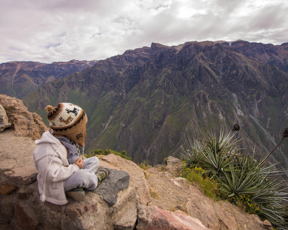 D of the Wandering Wagars looks out over Colca Canyon Peru waiting to view the Andean Condors in Colca Canyon with kids