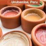 Clay pots filled with traditional paints at the ceramics painting with kids workshop at Ceramica Seminario in Urubamba Peru