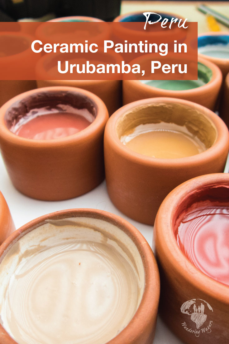 Clay pots filled with traditional paints at the ceramics painting with kids workshop at Ceramica Seminario in Urubamba Peru