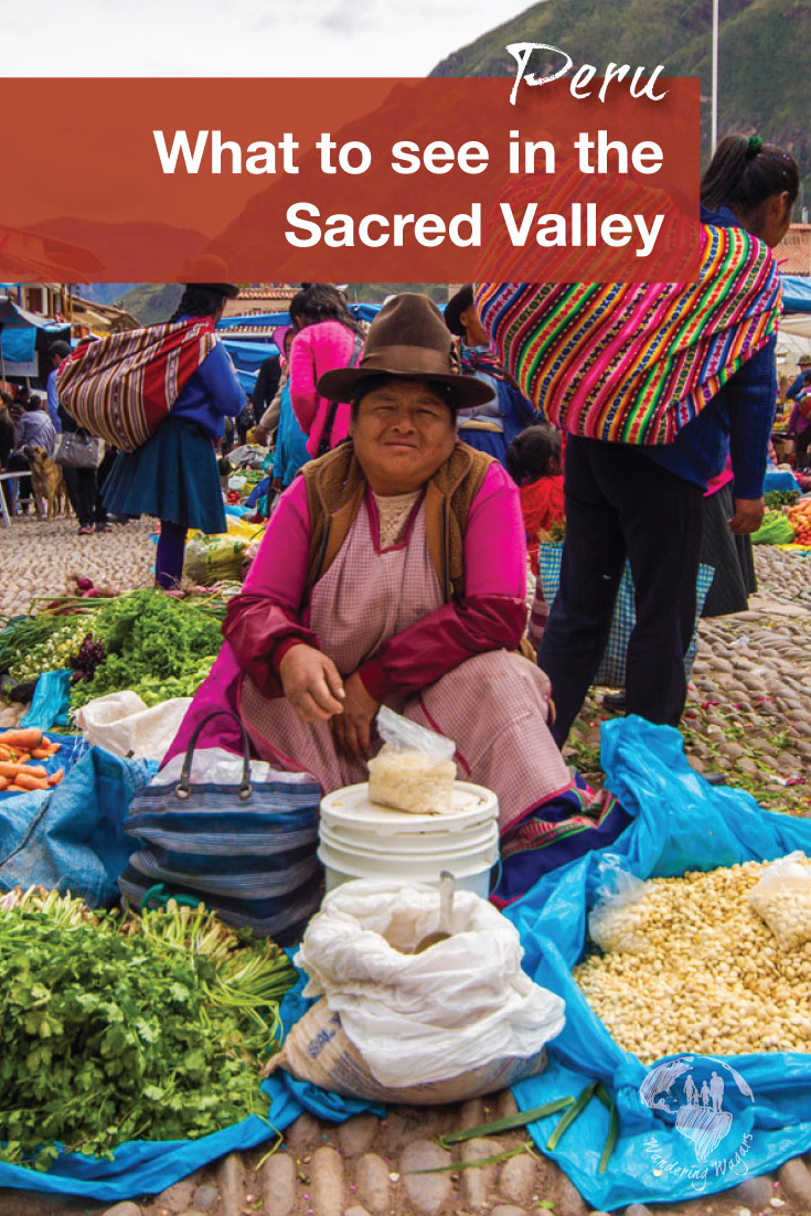 A Quechua woman sells food and grains at the Pisac Market during a day trip to the Sacred Valley Peru